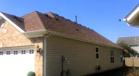 a house with a cartoon character in front of it