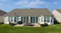 a house with a lawn and a large front yard
