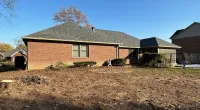 a house with a dirt yard