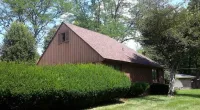 a building with Owens Corning Duration Shingles