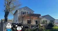 a house with a fence and trees