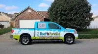 a Roof It Forward truck parked in front of a customer's home