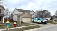 a police car parked in front of a house