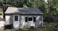 a shed with Owens Corning Duration Shingles