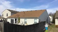 a house with trees in the background