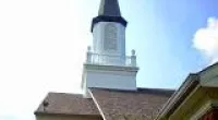 a spire on top of a church roof