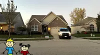 a couple of toys in front of a house