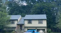 a car parked in front of a house