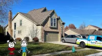 a house with a car parked in the driveway