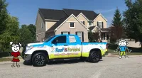 a small truck parked in front of a house