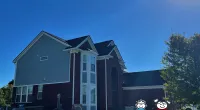 a house with a statue in front of it
