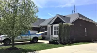 a truck is parked in front of a house
