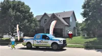a truck is parked in front of a house