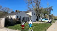 a couple of people in clothing in front of a house