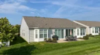 a house with a lawn and a large yard