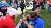 a little boy getting face paint