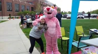 a girl posing with the Pink Panther