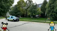 a cartoon character and a car in a driveway