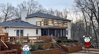 a house with a cartoon character in front of it