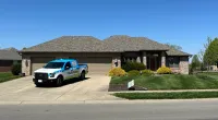 a truck parked in front of a house