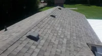 a closeup of a roof with new shingles