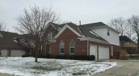 snow in front of a house