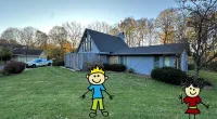 a couple of stuffed toys in a yard with a house in the background