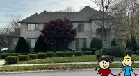 a house with a driveway and a driveway with a cartoon character in front of it