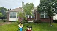 a couple of toy characters in front of a house