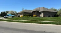 a house with a truck parked in front of it