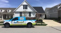 a truck is parked in front of a house