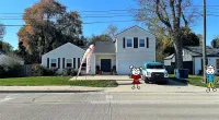 a white house with a flag on the front