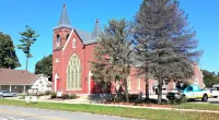 trees next to a church building