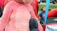 a kid hugging Pink Panther