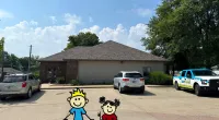 a couple of toy characters in front of a house