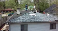 people working on a customer's roof