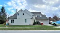 a fire hydrant in front of a house