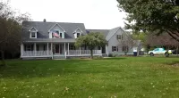 a house with a large lawn in front