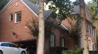 a car parked in front of a house
