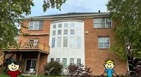 a building with a cartoon character in front of it