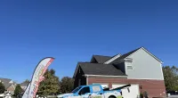 a truck parked in front of a house