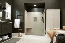 Thumbnail for Modern bathroom with walk-in shower, dark walls, white towels, wooden vanity, and decorative lantern and vase.