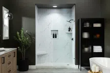 Thumbnail for Modern bathroom with freestanding tub, wooden vanity, glass shower, and dark green walls.