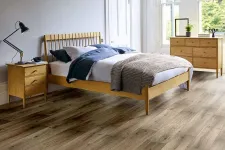 Thumbnail for Modern bedroom with wooden bed frame, hardwood floor, dresser, nightstand, and natural light from large windows.