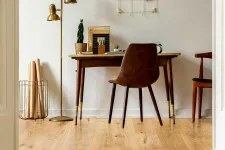 Thumbnail for Cozy home office with wooden desk, brown chair, gold floor lamp, and decorative wall grid in minimal style