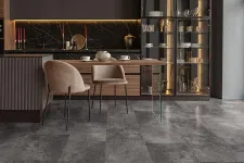 Thumbnail for Modern kitchen with dark marble backsplash, illuminated glass cabinet, and sleek gray stone flooring.