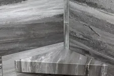 Thumbnail for Gray marble corner shelf mounted on matching marble walls with natural stone patterns.