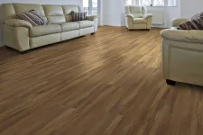 Thumbnail for Bright living room with beige leather sofas and armchair on natural wood flooring with white walls and large windows