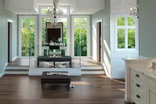 Thumbnail for Spacious modern room with dark wood flooring, crystal chandeliers, large windows, and a vanity mirror setup.