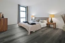 Thumbnail for Modern bedroom with dark wood flooring, neutral bedding, wooden furniture, floor-to-ceiling window, and bedside lamps